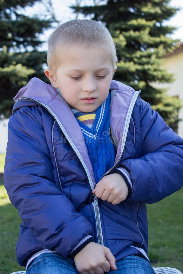 Boy wearing a jacket with a zipper royalty free stock photography
