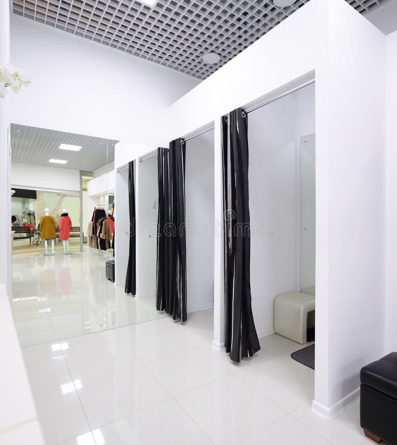 Interior of dressing room at cloth store stock photography