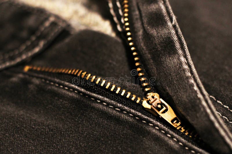 Jeans with broken lock zipper. Metal object stock image