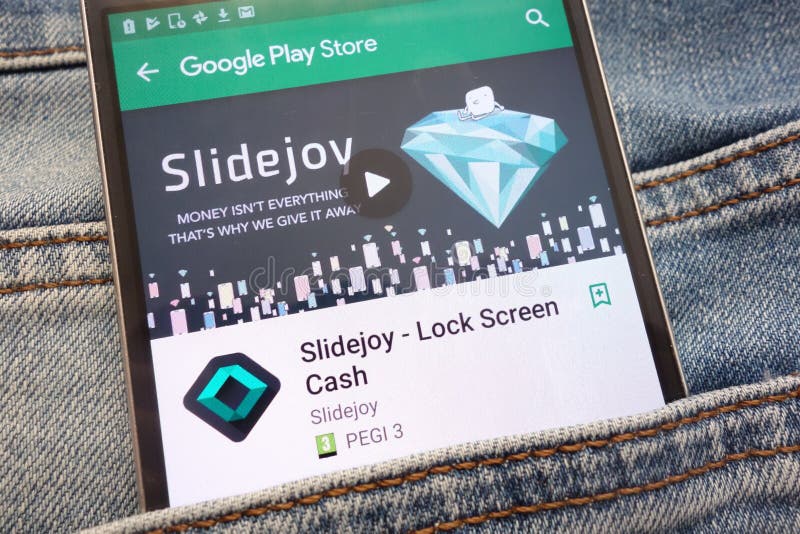 Slidejoy - Lock Screen Cash app on Google Play Store website displayed on smartphone hidden in jeans pocket. KONSKIE, POLAND - JUNE 12, 2018: Slidejoy - Lock royalty free stock photography