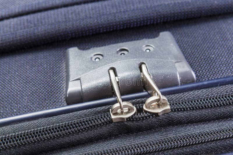 Lock with numbers on the suitcase zipper. Lock with numbers zipper of a blue suitcase stock image