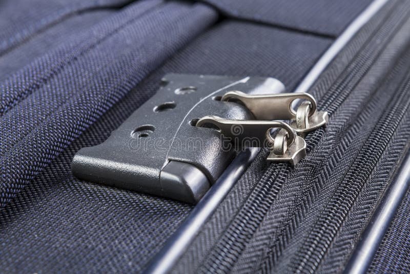 Lock with numbers on the suitcase zipper. Lock with numbers zipper of a blue suitcase stock photography