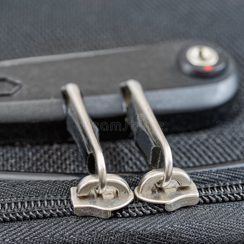 Lock with numbers on suitcase zipper. Close-up view to lock with numbers on suitcase zipper royalty free stock image