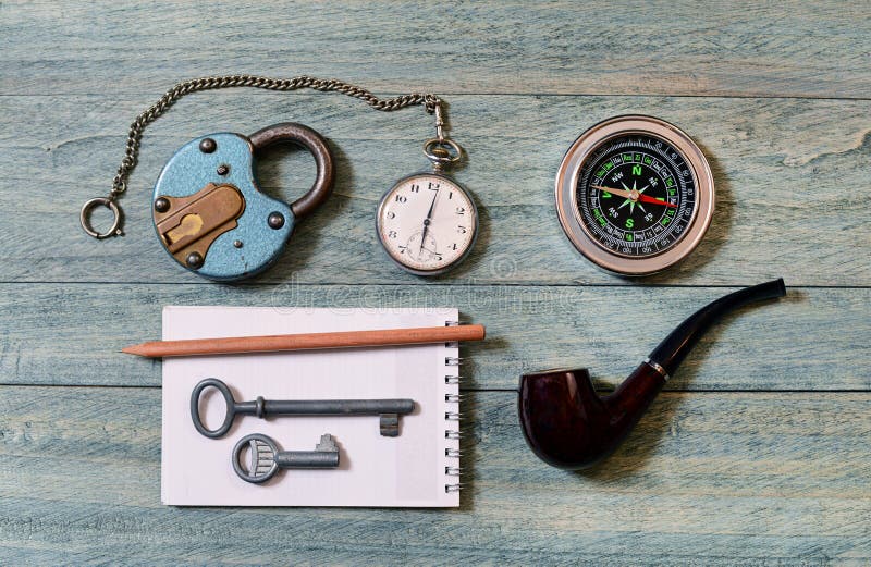 The old lock, pocket watch and compass. On the table royalty free stock image