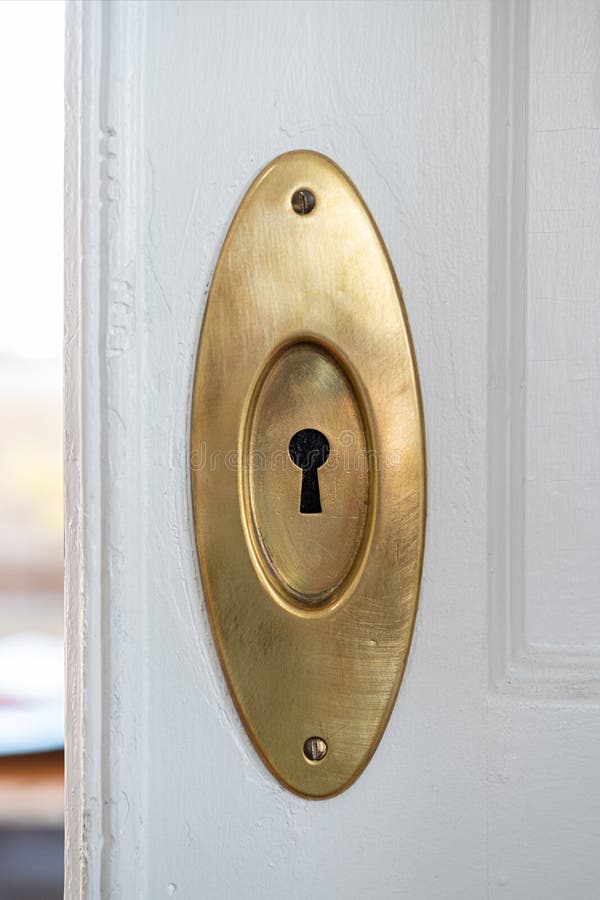 Vintage Brass Lock. To a freshly painted white pocket door stock photography