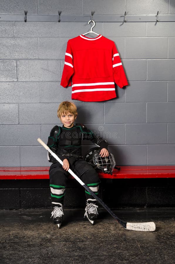 Young Boy in Hockey Dressing Room stock images