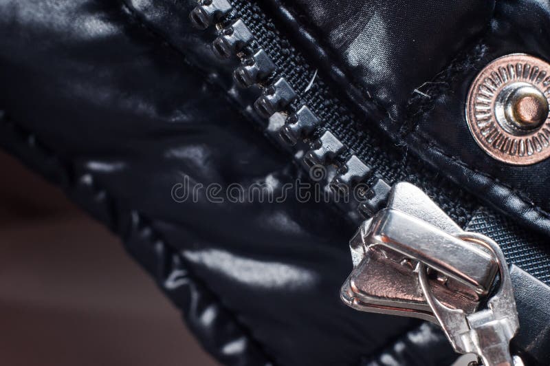 Zipper clasp with lock on the jacket in black, close-up.  royalty free stock photos