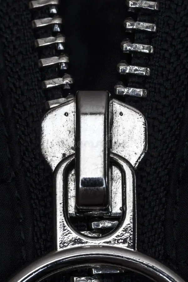 Zipper lock on the jacket. Chromed zipper lock on a blue jacket close-up stock image