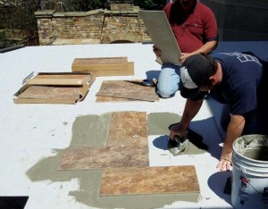 Installing tile over a waterproofing membrane, using thin-set mortar. Photo courtesy Duradek