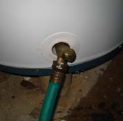 Garden hose connected to hot water heater